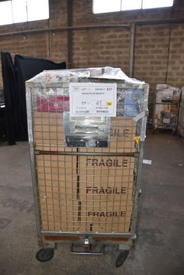 a metal cart with a sign on it in a warehouse