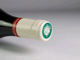 a bottle of wine that is sitting on a table