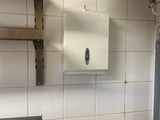 a toilet and a sink in a small bathroom
