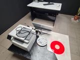 a desk with a computer and a record player on it