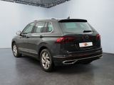 the back of a black volkswagen suv parked in a garage
