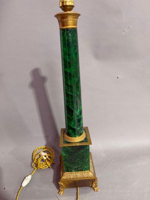 an image of a green and gold lamp on a white background