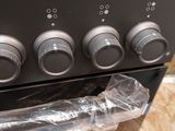 an image of a stove with four knobs on it