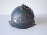 a blue helmet on a white table with a white background