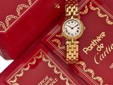 a red box with a gold watch on it