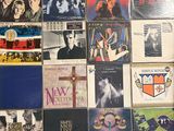 a lot of records on the wall of a room