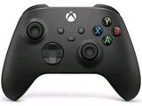 a close up of a black xbox controller on a white surface
