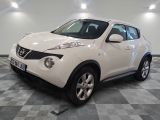une photo d'un SUV Nissan Juke blanc garé dans un garage