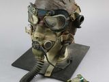 an old gas mask with a gas mask attached to it ' s head