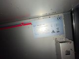 a picture of a sign on the wall of a train