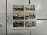 a picture of a piece of art on a tile floor