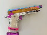 a toy gun that is sitting on top of a table