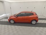 an image of a small orange car in a garage