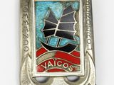 an image of a badge with a ship on it on a white surface