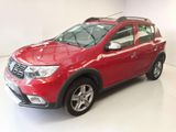 the red dacia is parked in a white room with a white floor
