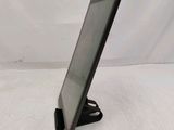 a close up of a tablet computer on a stand on a white surface