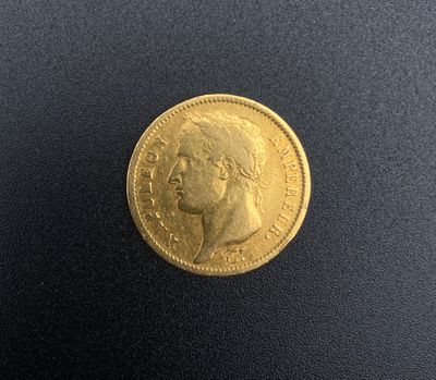 une pièce d'or portant le portrait d'un homme
