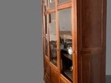 an image of a wooden cabinet with glass doors