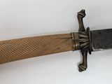 a knife hanging on the wall with a wooden handle