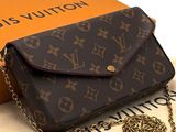 an image of a louis vuitton purse with a chain