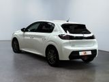the rear of a white car is parked in a white room
