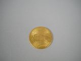 an image of a gold coin on a white surface