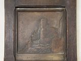 painting of a castle in a wooden frame on a white wall