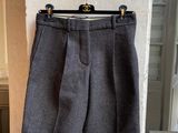 the shorts are hanging on a hanger on the wall