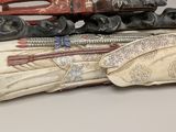 several pieces of art are stacked on top of each other on a table