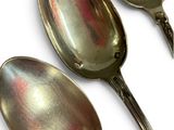 three spoons that are sitting next to each other