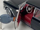 a toy car with a key attached to it ' s door