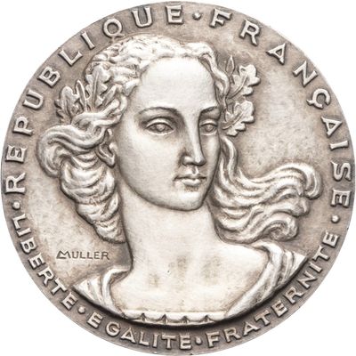 a close up of a coin with a woman ' s face on it
