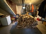 a pile of wood in the middle of a room