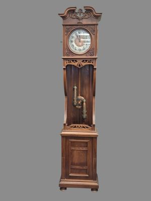 a grandfather clock that is on display on a gray background