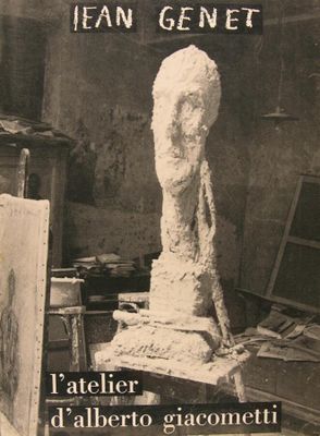 an old photo of a sculpture in a studio