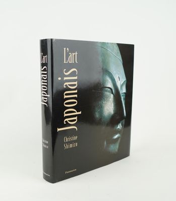 the front cover of a book with a picture of a statue on it