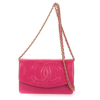 a pink chanel bag with a chain strap