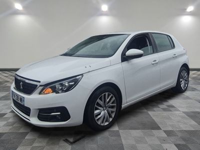 a picture of a white car parked in a garage