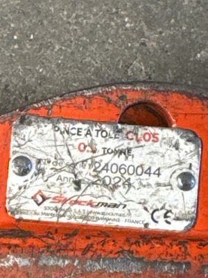 a close up of a piece of metal with a tag on it