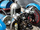a blue motorcycle parked on the side of the street
