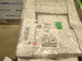 a pile of toilet paper wrapped in plastic on top of a table