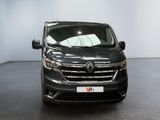 the front view of a black van parked in a showroom