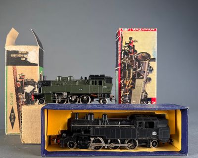 a toy train in a box next to a box of other toys