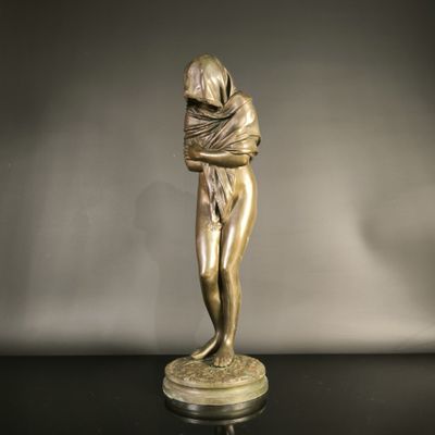 bronze statue of a woman holding a baby in her arms