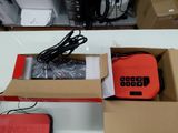 a box with a red electronic device inside of it