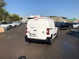 a white van that is parked in a parking lot