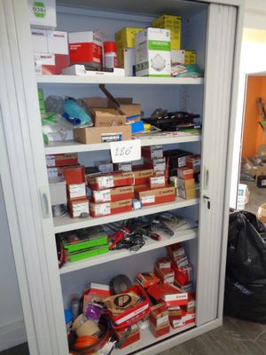many boxes and boxes on the shelves in the room