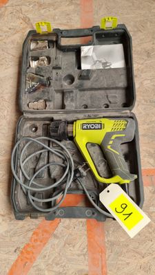 a tool in a case that is on the floor