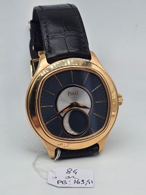 une image représentant une montre-bracelet en or avec un cadran noir