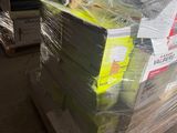 a stack of tennis balls wrapped in plastic on a pallet